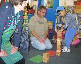h meteorologists A child adds a block to a stack as part of an activity in a preschool classroom