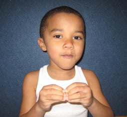 Kid wearing white tank top